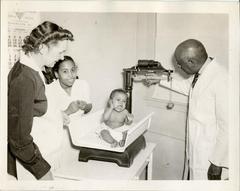 Infant Being Weighed at Clinic