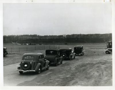 Cars Driving Away in the 1930s
