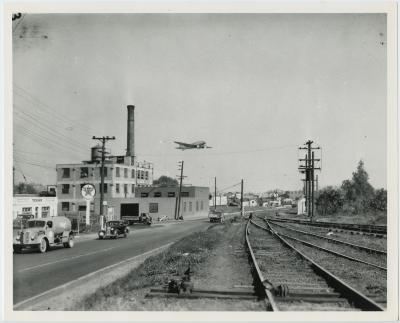 Low Flying Plane and Texaco Station
