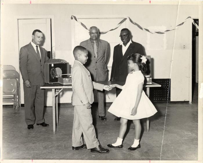 Two Children Dancing, with Ernest Johnson in background