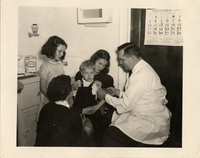 Student being treated by doctor, 1940