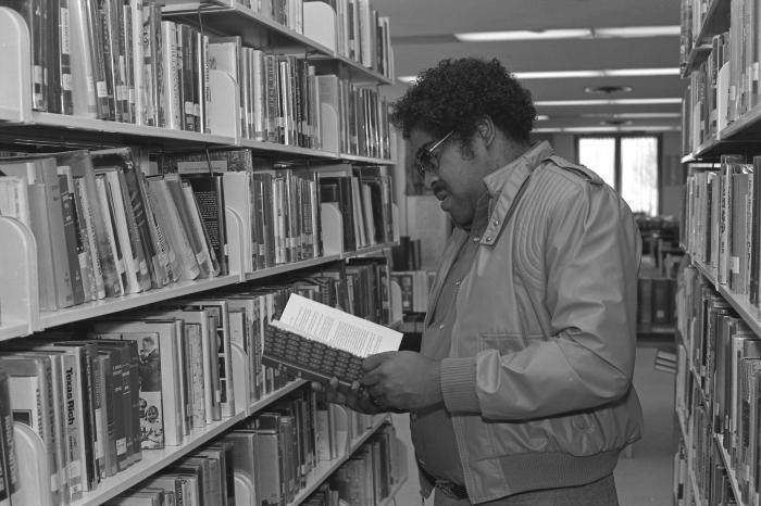 Reading a Book in the Library
