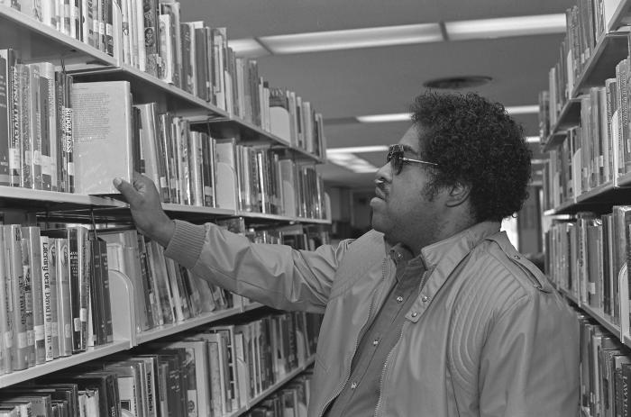 Selecting a Book at the Library
