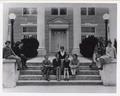 Students Seated in Front of School