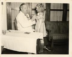 Child being examined by doctor, 1940