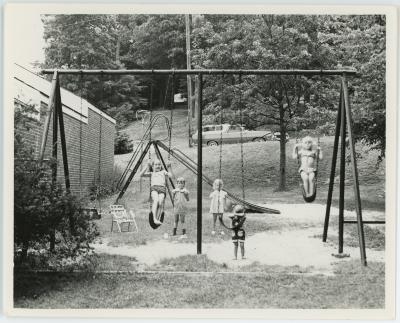 Children Swinging Outside Barcroft Apartments