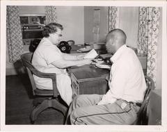 Nurse interviewing patient in chronic disease program, 1958