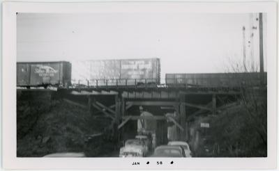 Cars Under Rail Bridge