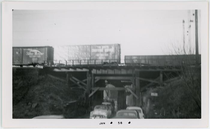 Cars Under Rail Bridge