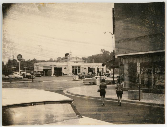 People Crossing the Street Near Gulf Auto