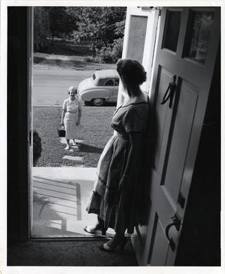 Nurse making home visit, 1958