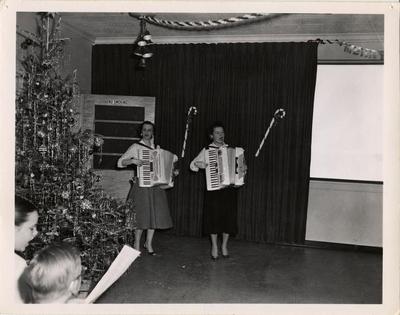 Accordionists performing at Crippled Children's Christmas party, 1957