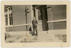 Man Standing In Front of Building