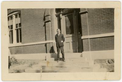 Man Standing In Front of Building