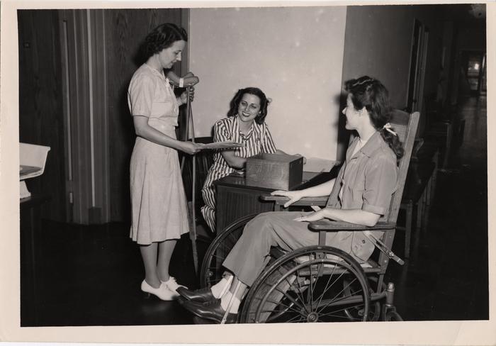 Nurse, patient, and clerk at clinic