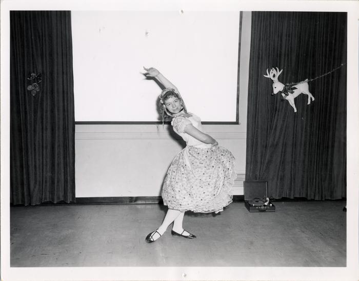 Dancer performing at Crippled Children's Christmas party, 1958