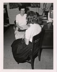 Nurse interviewing mother registered in crippled childrens' service, 1958
