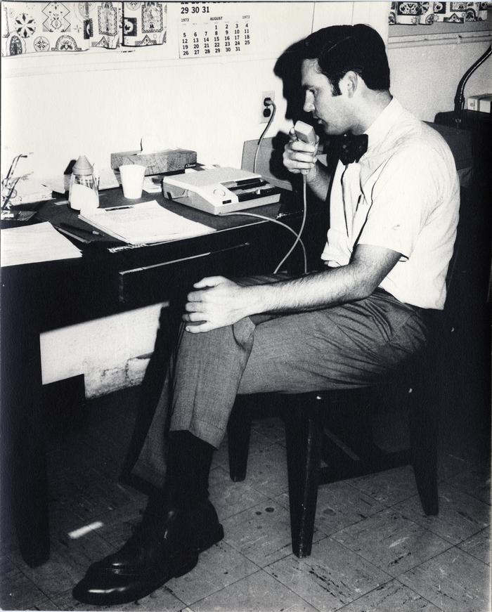 Man Speaking into Dictaphone